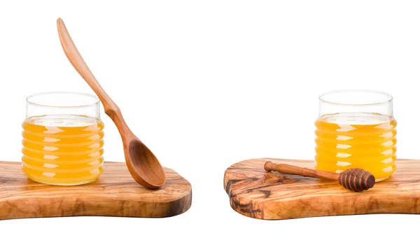 Set of honey jars on wooden plank isolated on white — Stock Photo, Image