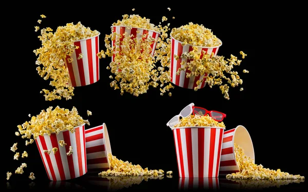 Eimer mit Popcorn und 3D-Gläsern isoliert auf schwarzem Hintergrund — Stockfoto