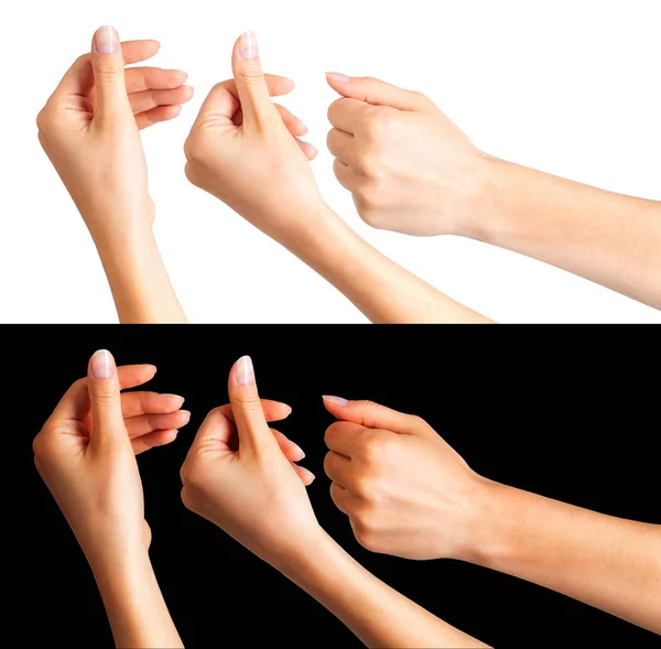 Frauenhände, die etwas mit zwei Fingern halten — Stockfoto