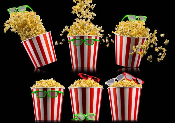 Set of buckets with popcorn and 3D glasses isolated on black background — Stock Photo, Image