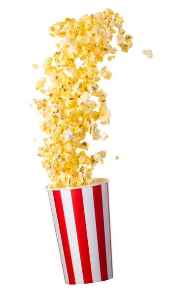 Vliegende popcorn van papier gestreepte emmer geïsoleerd op zwarte achtergrond — Stockfoto