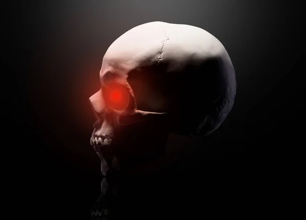 Modelo del cráneo humano con ojos rojos aislados sobre fondo negro — Foto de Stock