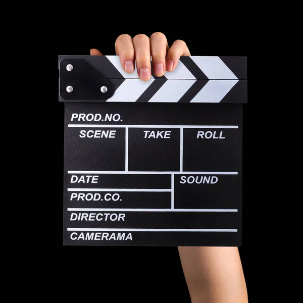Human hand holding film clapper board isolated on black background — Stock Photo, Image