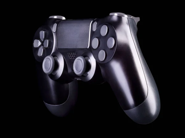 Juego de video negro joystick gamepad aislado sobre un fondo negro —  Fotos de Stock