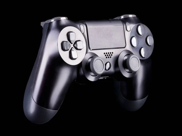 Black video game joystick gamepad isolated on a black background — Stock Photo, Image