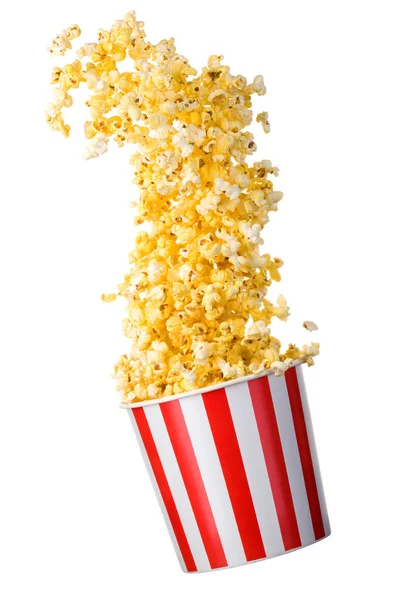 Vliegende popcorn van papier gestreepte emmer geïsoleerd op zwarte achtergrond — Stockfoto