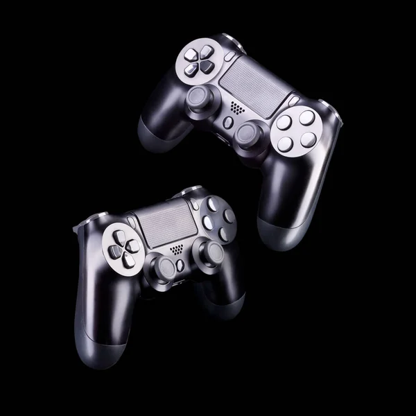 Set of black video game joysticks gamepad isolated on a black background