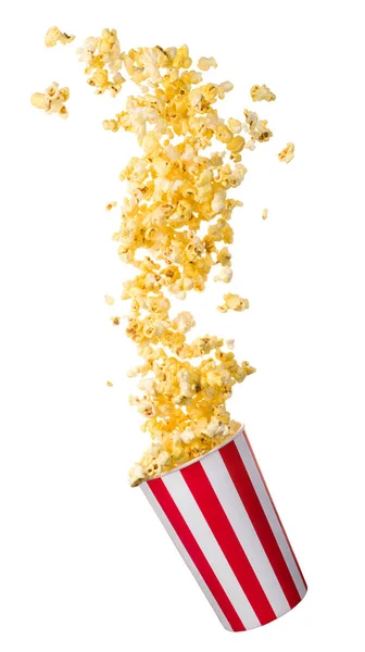 Flying popcorn from paper striped bucket isolated on black background — Stock Photo, Image