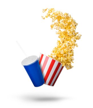 Paper striped bucket with popcorn and cup of soft drink isolated on white background, movie night concept or watching TV.