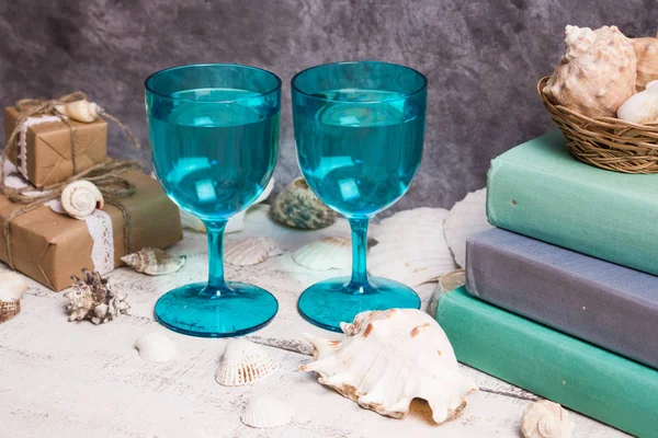 Blue glasses, shells, books, gifts