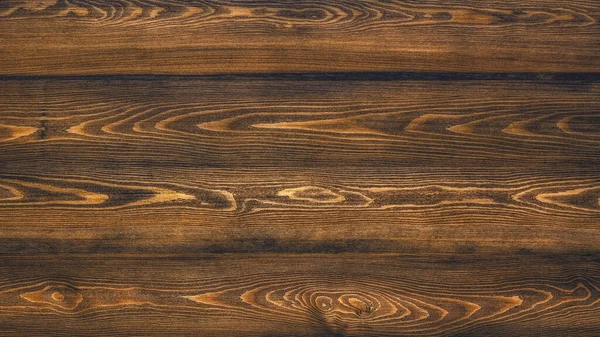 Natural toned wooden planks of larch . Abstract texture background, blank pattern