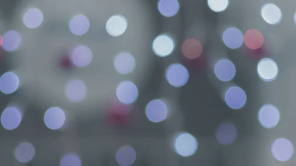 Soyut düzensiz bokeh, farklı renklerde çelenkler, yakın plan.