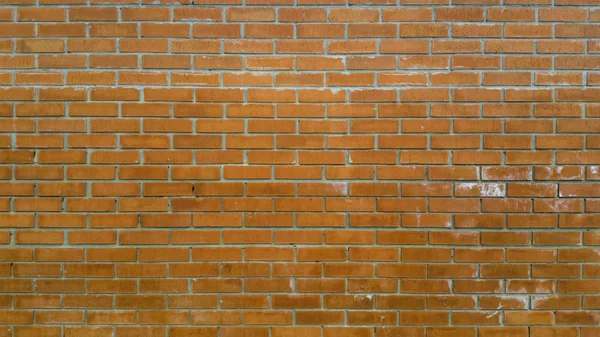 Red brick wall with white washed areas — Stock Photo, Image