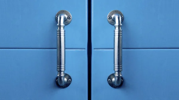 blue cabinet doors with metal handles