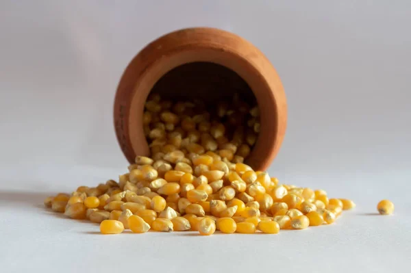 Small Clay Pot Laying Its Side Unpopped Popcorn Spilling Out — Stock Photo, Image