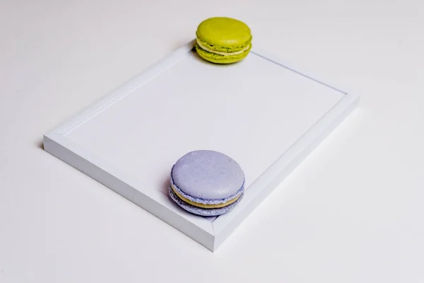 Colorful macaron on white frame — Stock Photo, Image