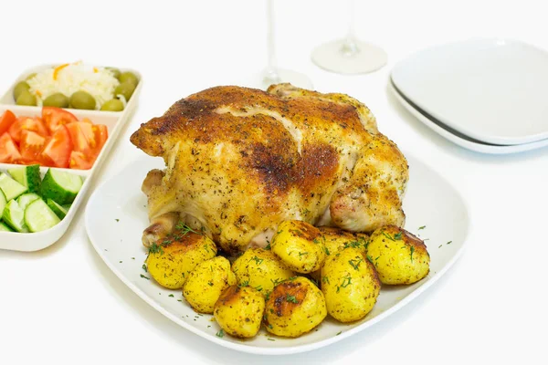 Roasted chicken and potatoes on white plate — Stock Photo, Image