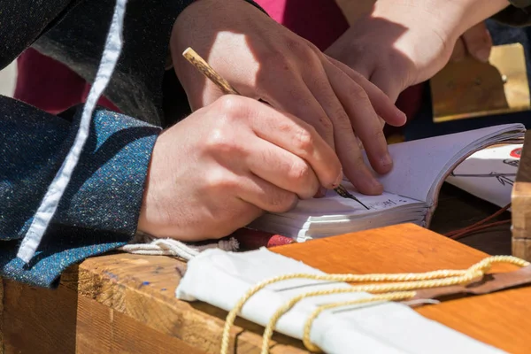 Scribe practicing traditional illumination — Stock Photo, Image