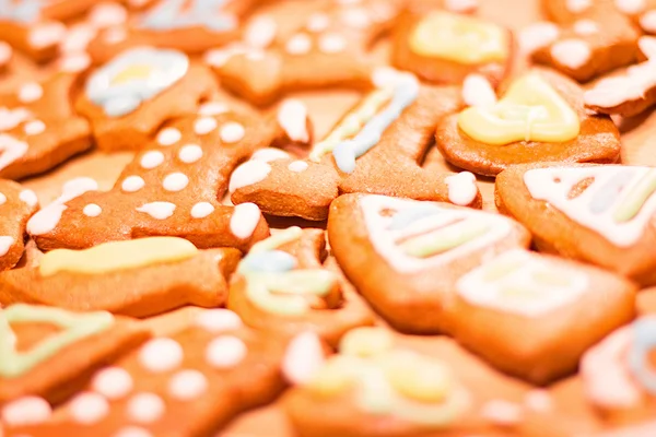 Gingerbread colorful decorated cookies - Christmas houses, bears, heart, moon, fish — Stock Photo, Image