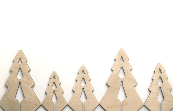 Composición con peleteras de madera contrachapada. Fondo ecológico navideño para la presentación de trabajos o textos. Hermosa tarjeta de felicitación . — Foto de Stock