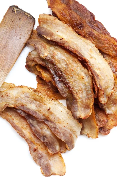 Daging babi dan sendok pada latar belakang kayu — Stok Foto