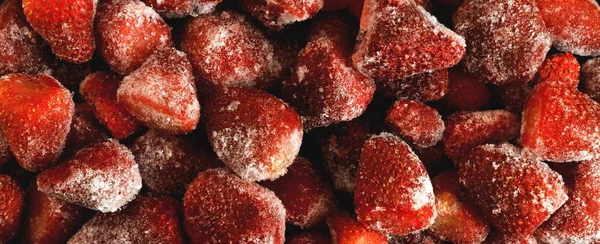 Panorama of frozen fresh strawberries
