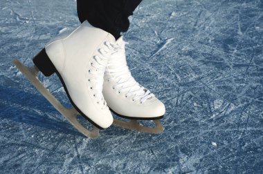 Women's skates on the ice clipart