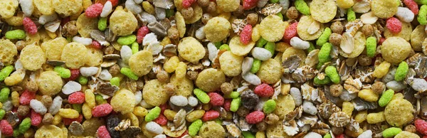 Background and test muesli four cereals. Panorama Banner.