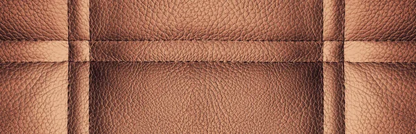 Brown leather with lines and embroidery background texture. Panorama. Large format. Banner.