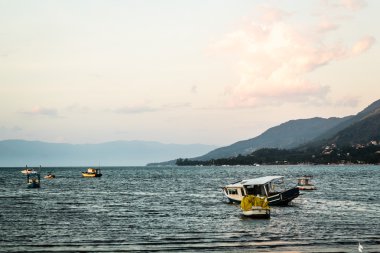 Boats and Mountains at Beautiful Island (Ilhabela) in San Paulo  clipart