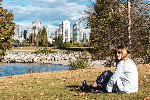 Girl Sitting on the Grass near Vanier Park in Vancouver, Canada — Stock Photo, Image