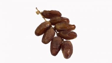 Kuru hurma meyve, phoenix dactylifera beyaz bir arka plana dayanır, gerçek zamanlı 4 k, hareketli görüntü