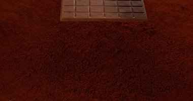 Çikolata Tablet Çikolata tozu üzerinde düşen