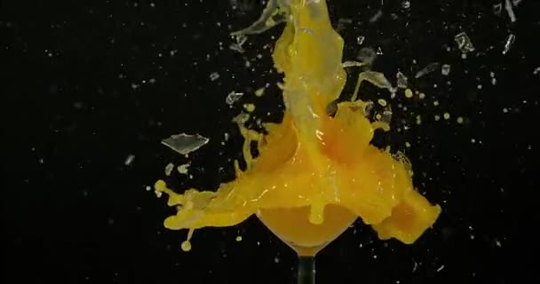 Glass of Orange Exploding — Stock Video