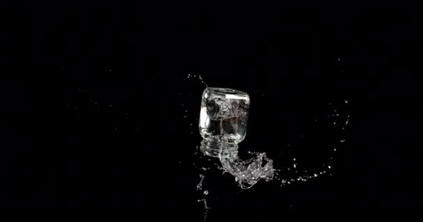 Glass Water Bouncing Splashing Black Background Slow Motion — Stock Video