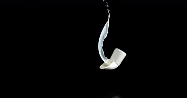 Glass Milk Bouncing Splashing Black Background Slow Motion — ストック動画