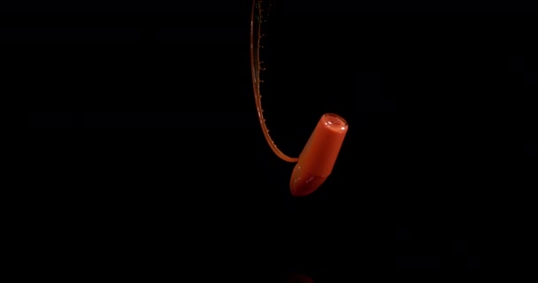 Glass Tomato Juice Bouncing Splashing Black Background Slow Motion — Stock Video