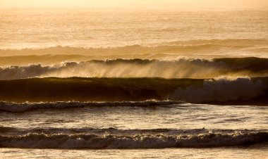 Waves in Atlantic Ocean at Sunset, Cape Cross in Namibia  