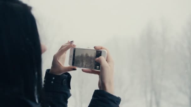 Girl take a photo of snow — Stock Video