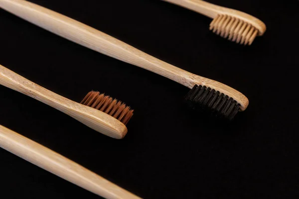 Group Eco Bamboo Toothbrushes Black Background Different Color Top View — Stock Photo, Image