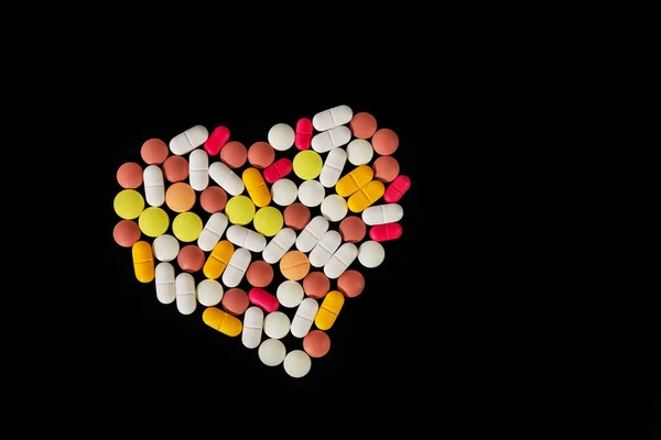 Molte Pillole Compresse Diverse Piegate Forma Cuore Sfondo Nero Molte — Foto Stock