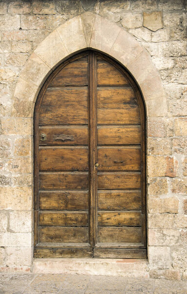  The entrance wooden door in an old Italian house.