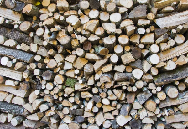 Leña de pared, fondo de leña seca picada . — Foto de Stock