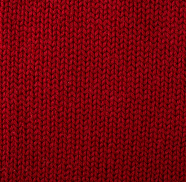 Knitted red woolen fabric background