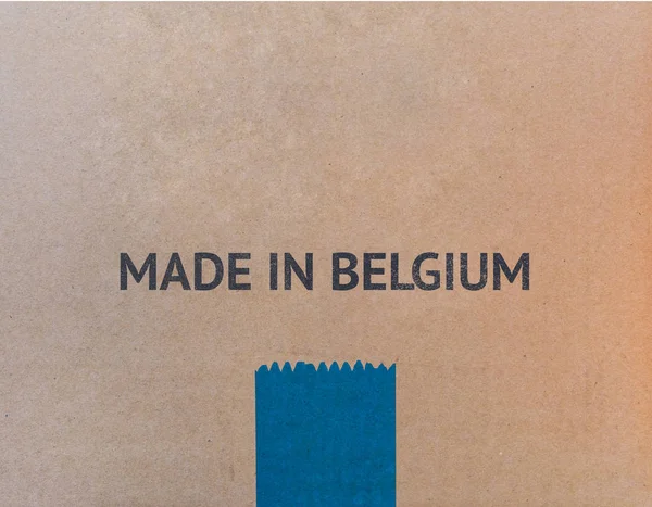 MADE IN BELGIUM written on brown cardboard box with copy-space. — Stock Photo, Image