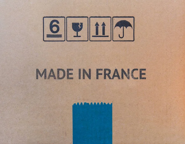 MADE IN FRANCE written on brown cardboard box — Stock Photo, Image