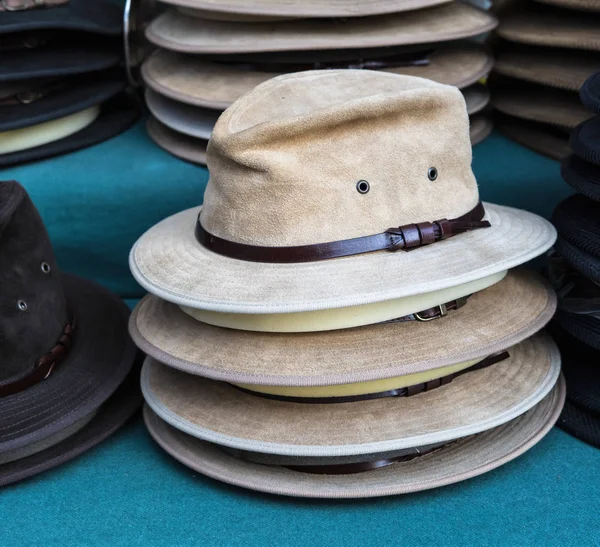 Rack of male hats on sale