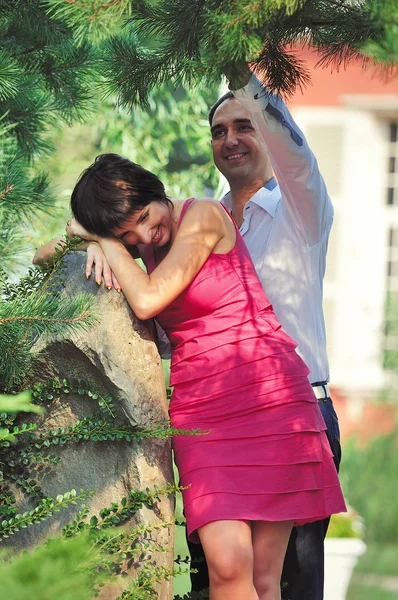 Smiling man and woman hugging on the nature — Stock Photo, Image