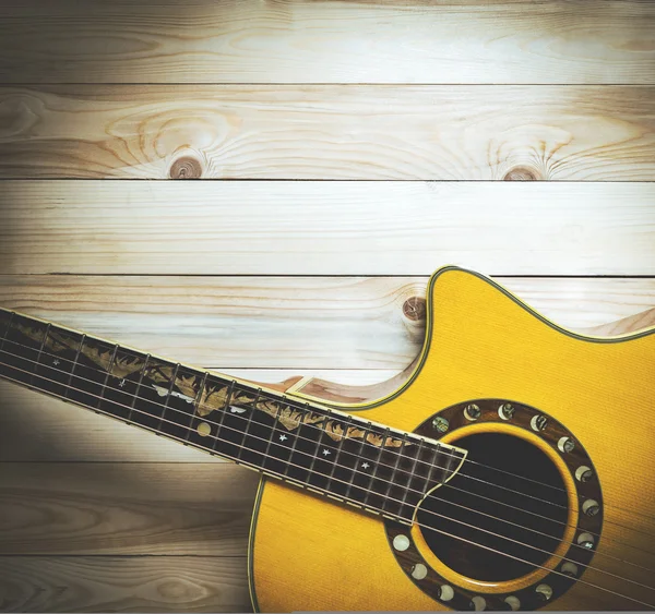 Half section of a guitar on wood with copy space — Stock Photo, Image