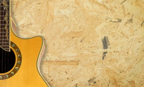 Kontrplak doku arka plan kopya alanı ile gitar — Stok fotoğraf